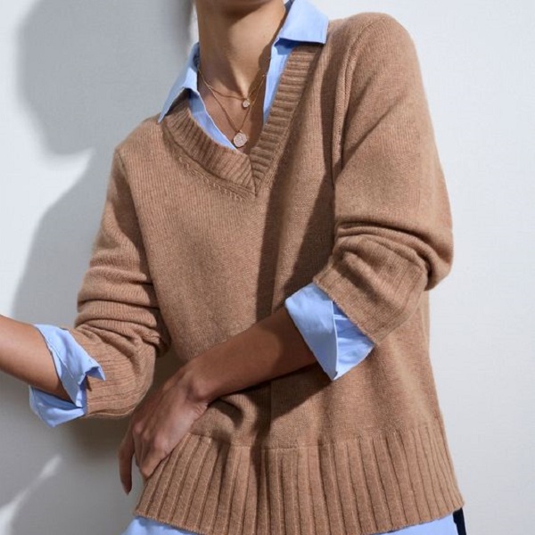 Master the art of layering with a sweater over a shirt 